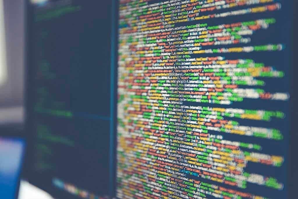 Lines of code displayed on a computer monitor, representing how teams version and track changes to AI prompts