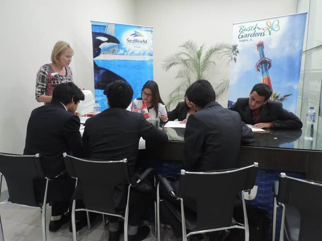 Two people in a job interview setting, representing hiring and job description writing