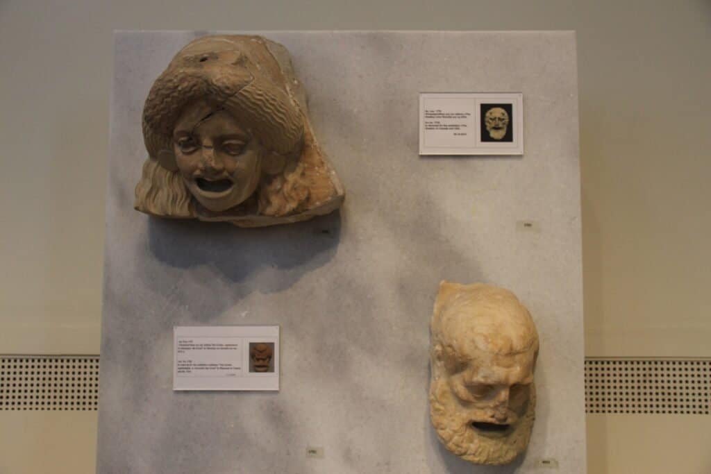 Ancient Greek marble sculptures of theater masks symbolizing personas and roles