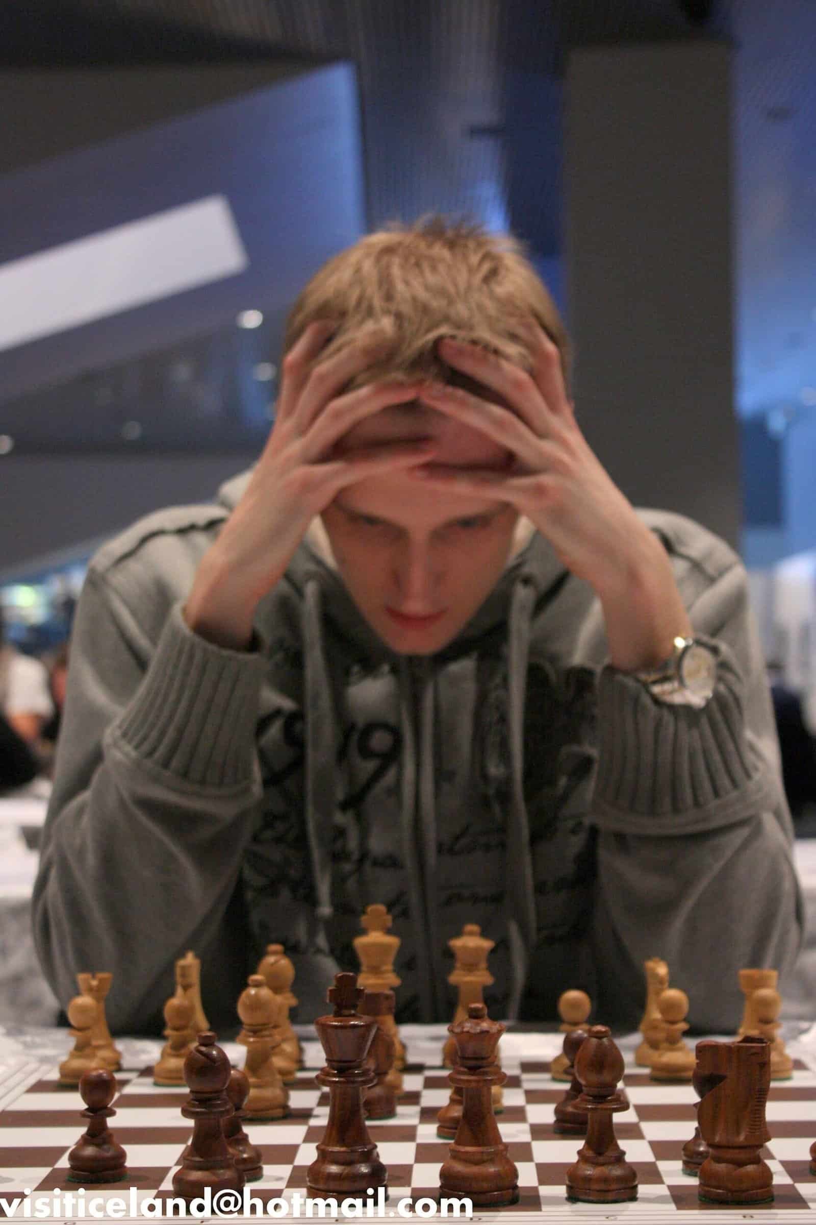 Chess player reasoning through a sequence of moves Chess player thinking through a multi-step sequence of moves, representing step-by-step reasoning