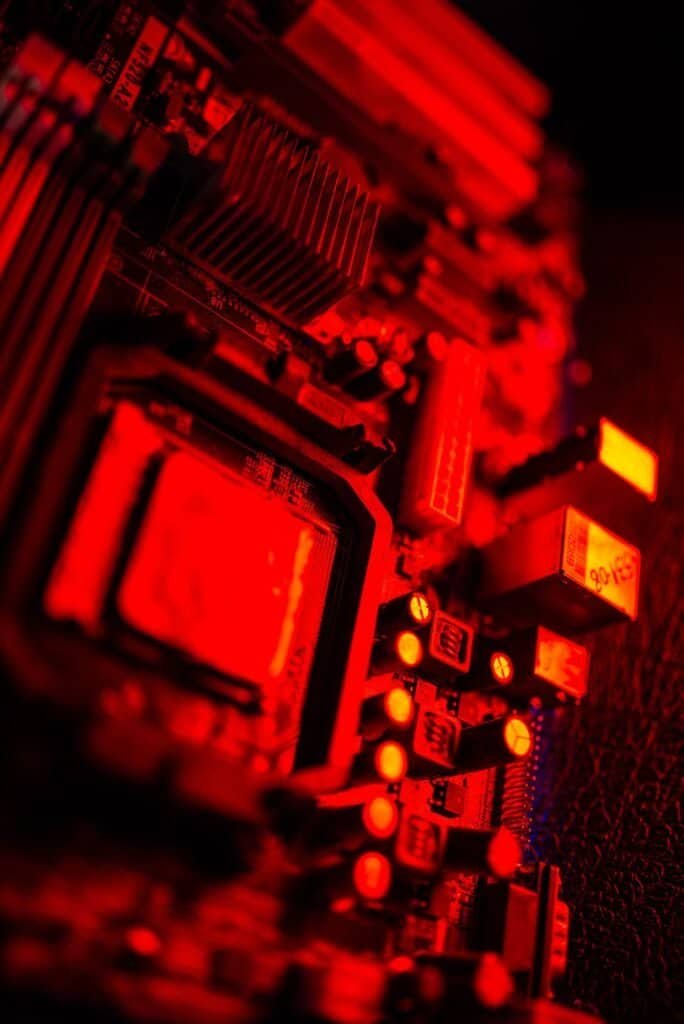 Close-up of an illuminated circuit board, representing compact AI model hardware