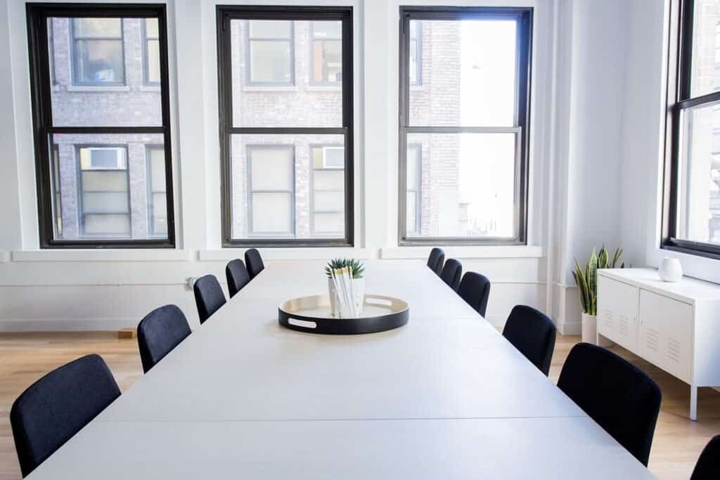 Empty minimalist meeting room with a table and chairs