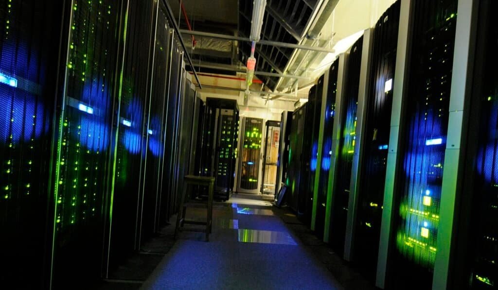 Server room with computing racks, representing the AI infrastructure behind Mixture of Experts models