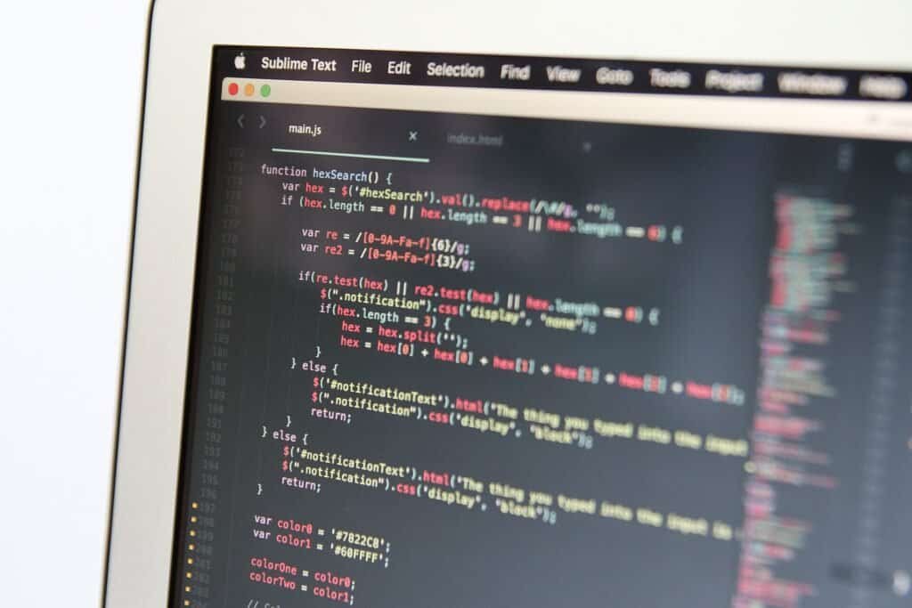 Close-up of code on a laptop screen, representing writing project documentation