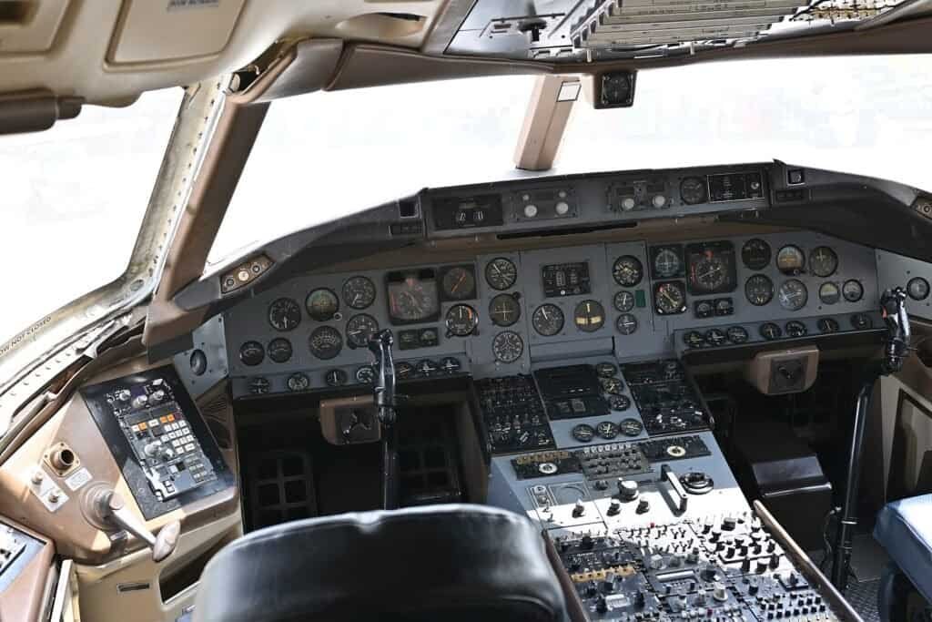 A dense array of cockpit dials and gauges, representing dialing reasoning depth up or down