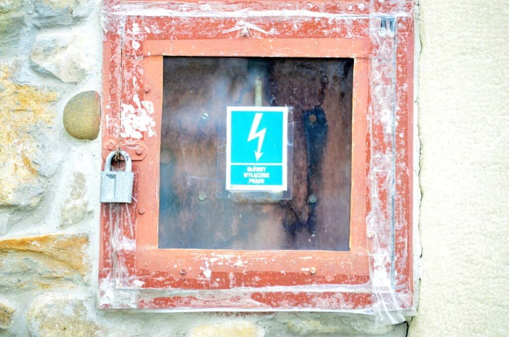 A black lightning bolt inside a yellow triangle electrical hazard warning sign