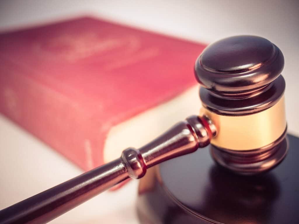 Gavel on a closed law book, representing legal compliance for AI-generated testimonials and reviews