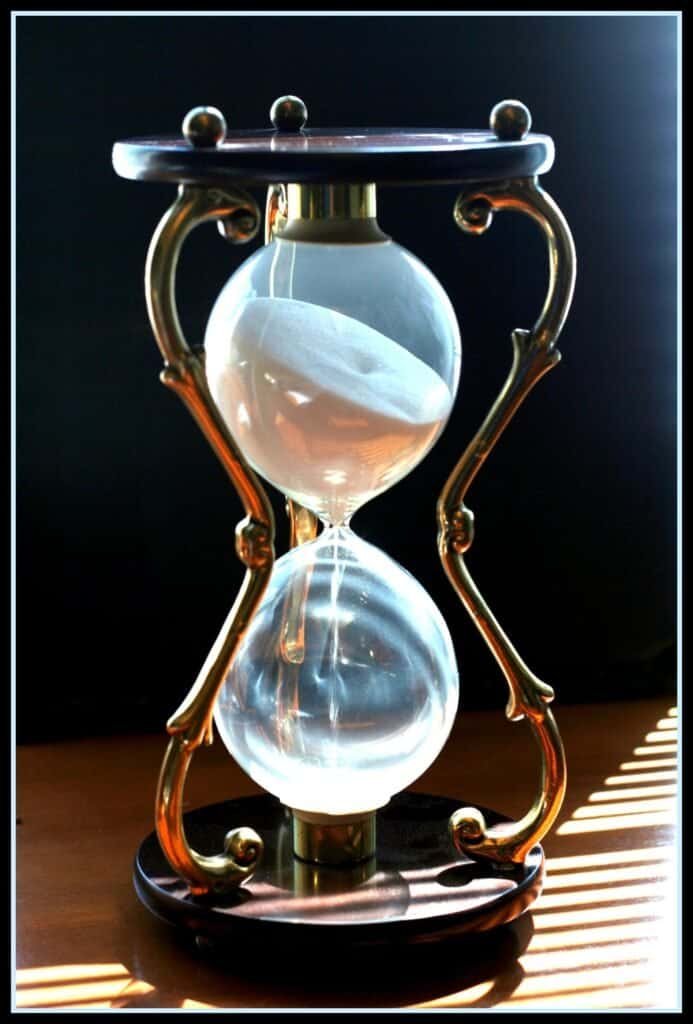 An hourglass filled with sand, representing a timeout