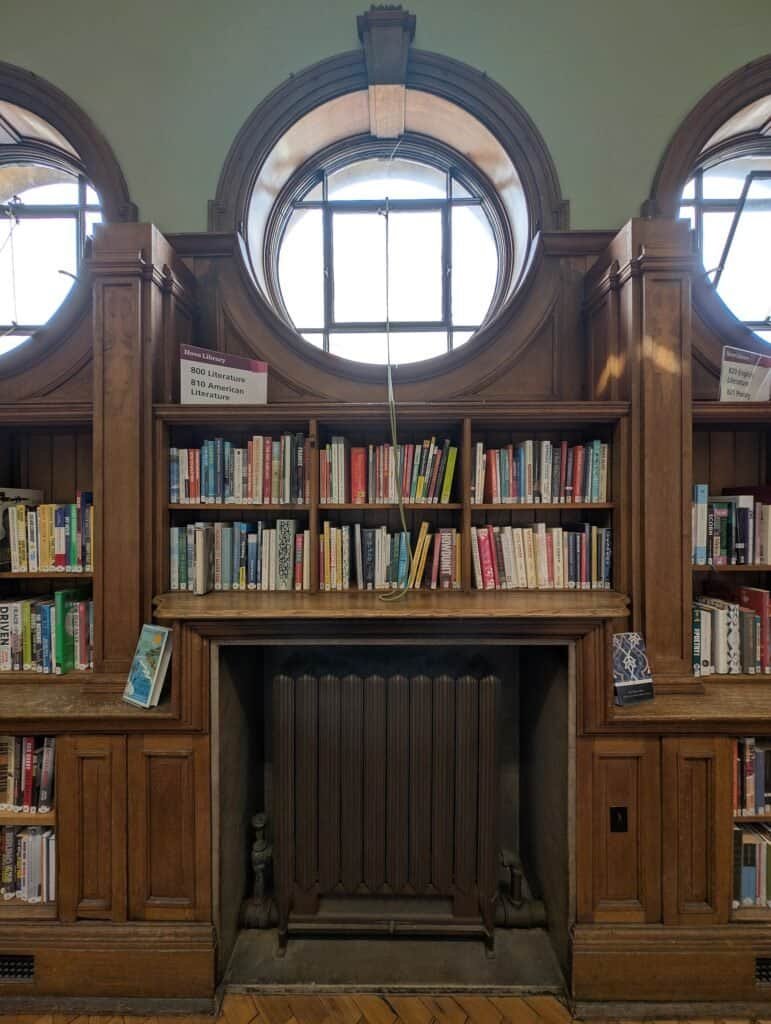 Rows of bookshelves in a library, representing organized, comprehensive coverage of a topic