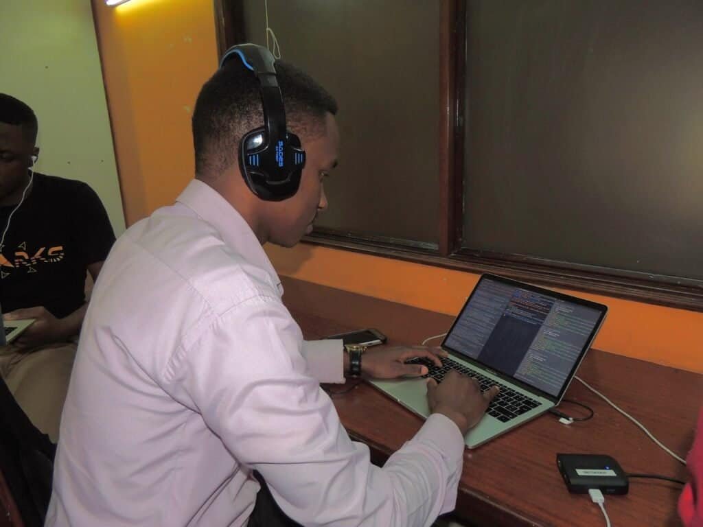 Person reviewing a model card and technical documentation on a laptop