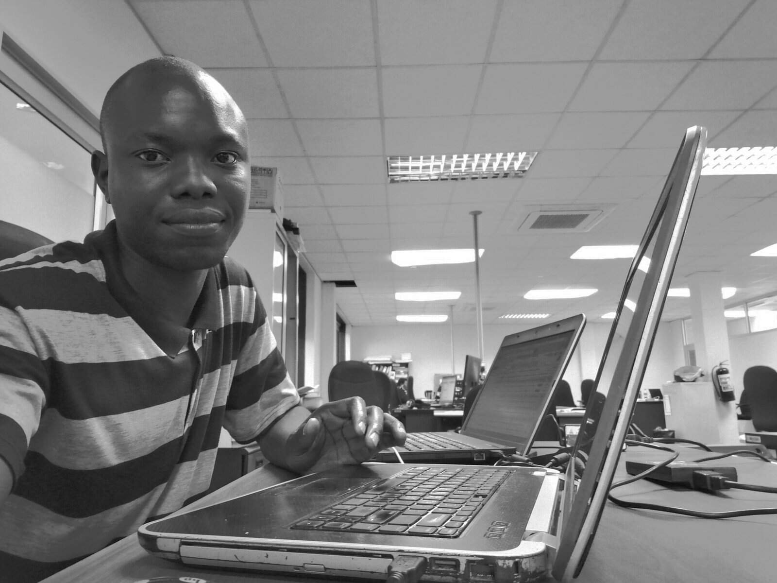 Software developer reviewing code at a laptop