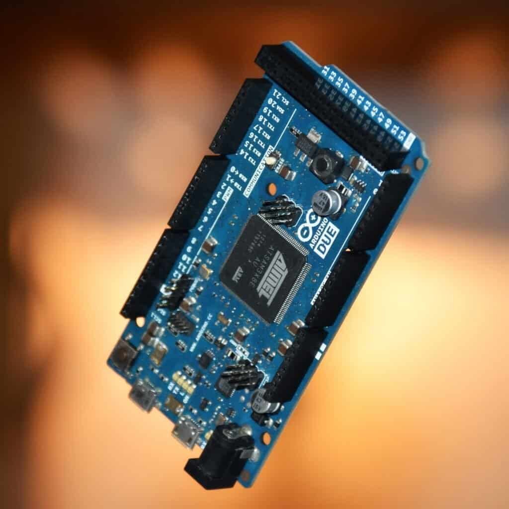An Arduino Due microcontroller board, used to illustrate deterministic circuit logic versus GPU inference